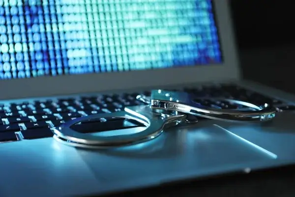 depositphotos 180423652 stock photo handcuffs on laptop keyboard